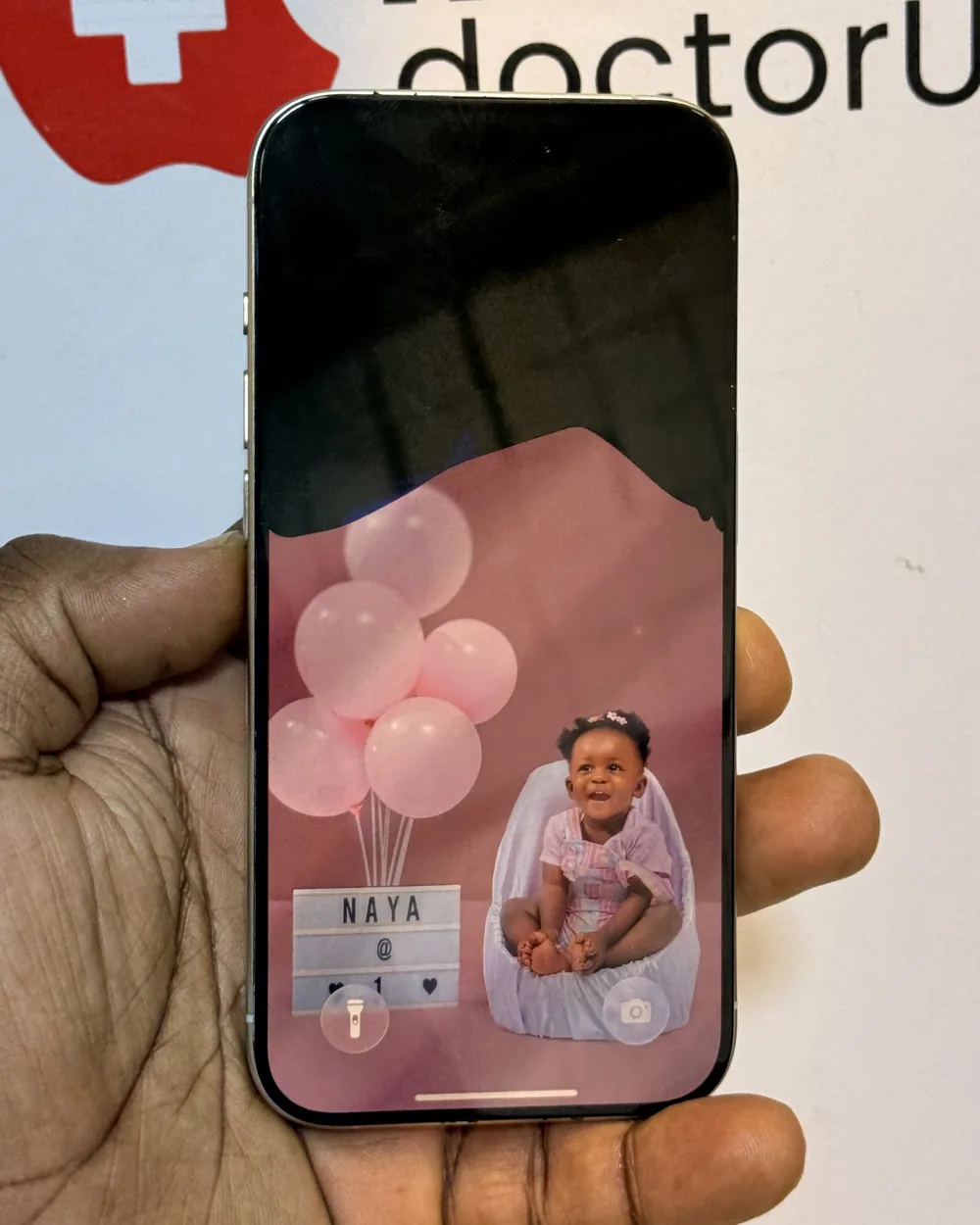 iPhone with a damaged display before screen replacement